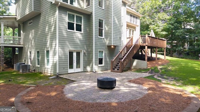 214 Davis Mill Rd, Ball Ground, GA 30107 - back of property with a fire pit, a patio, stairs, french doors, and a wooden deck