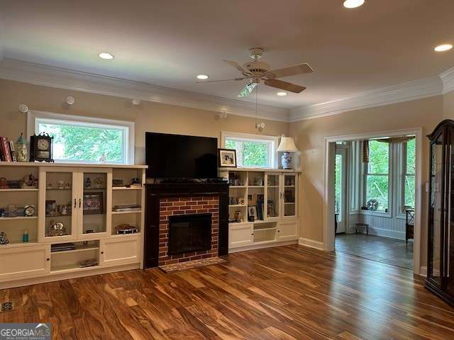 3131 Rocky Branch Rd Unit 280, Watkinsville, GA 30677 - unfurnished living room with ceiling fan, wood finished floors, crown molding, a brick fireplace, and recessed lighting