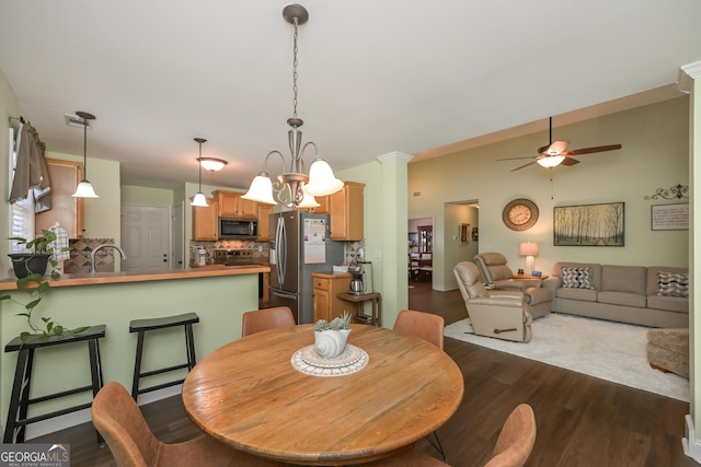 170 Saddleridge Dr, Bremen, GA 30110 - dining area featuring a ceiling fan, dark wood-style flooring, and decorative columns