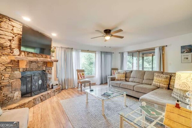 327 Brucken Strasse Unit 311, Helen, GA 30545 - living area with ceiling fan, wood finished floors, and a stone fireplace