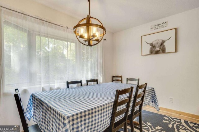 327 Brucken Strasse Unit 311, Helen, GA 30545 - dining space featuring a chandelier and wood finished floors