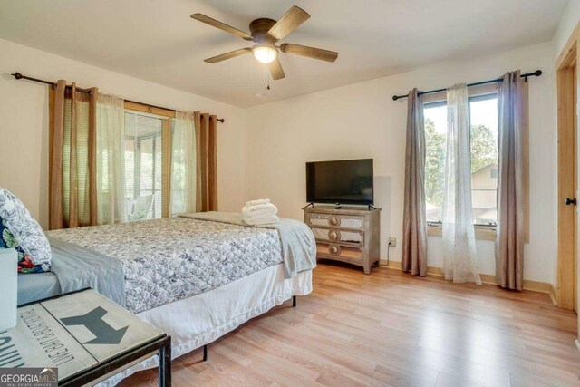 327 Brucken Strasse Unit 311, Helen, GA 30545 - bedroom with light wood-style flooring and a ceiling fan