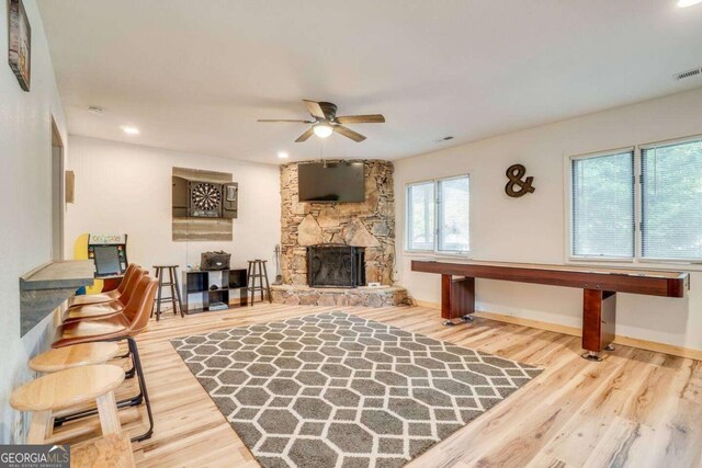 327 Brucken Strasse Unit 311, Helen, GA 30545 - living area with a ceiling fan, wood finished floors, a stone fireplace, and recessed lighting