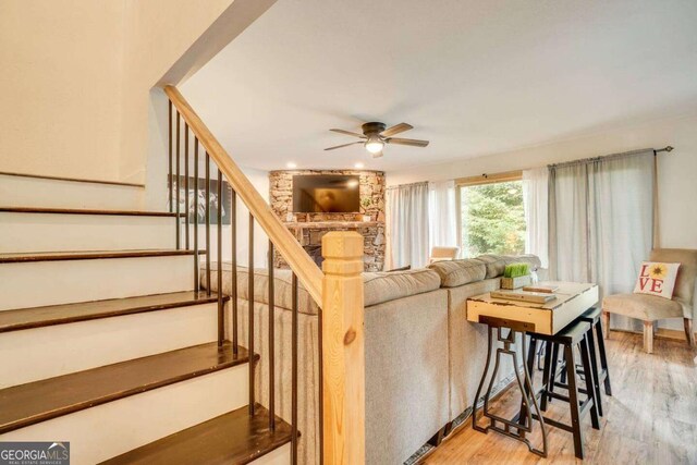 327 Brucken Strasse Unit 311, Helen, GA 30545 - living area featuring a ceiling fan, light wood-type flooring, and stairway