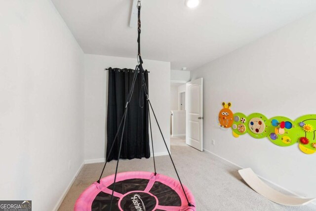 109 Grand Hickory Way, Dawsonville, GA 30534 - game room with light colored carpet and baseboards