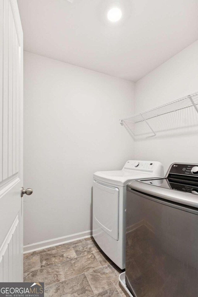 109 Grand Hickory Way, Dawsonville, GA 30534 - washroom with washer and dryer and baseboards