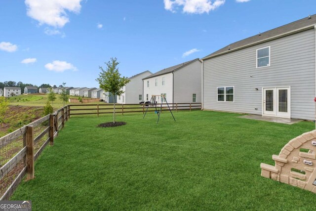 109 Grand Hickory Way, Dawsonville, GA 30534 - fenced backyard with a playground and a residential view