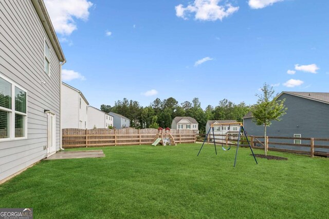 109 Grand Hickory Way, Dawsonville, GA 30534 - fenced backyard with a playground