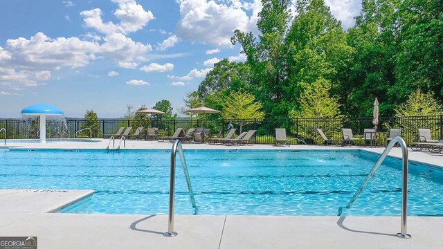 109 Grand Hickory Way, Dawsonville, GA 30534 - community pool with a patio area