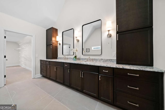 4544 Cavallon Way NW, Acworth, GA 30101 - bathroom featuring double vanity and a spacious closet