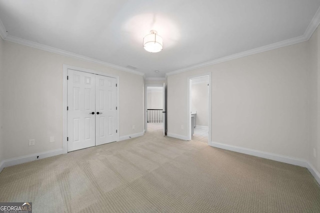 4544 Cavallon Way NW, Acworth, GA 30101 - unfurnished bedroom featuring light colored carpet, crown molding, and a closet