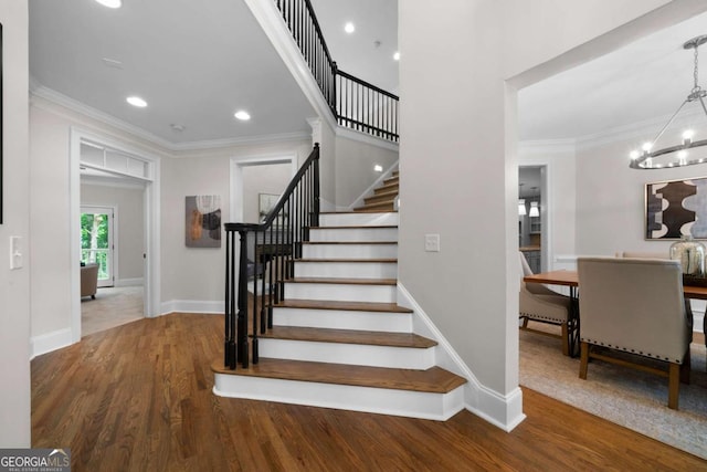 4544 Cavallon Way NW, Acworth, GA 30101 - stairs with a chandelier, crown molding, wood finished floors, and recessed lighting
