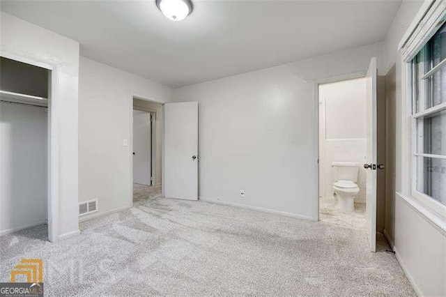 741 Greenhill Dr NE, Conyers, GA 30012 - unfurnished bedroom with carpet, ensuite bath, and a closet