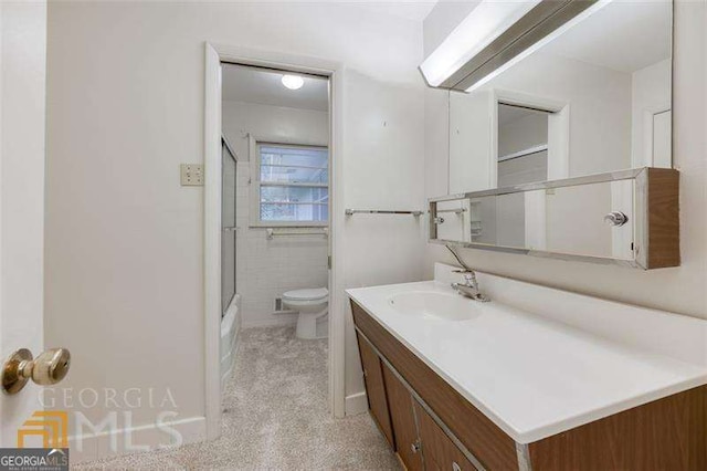 741 Greenhill Dr NE, Conyers, GA 30012 - bathroom featuring vanity and combined bath / shower with glass door