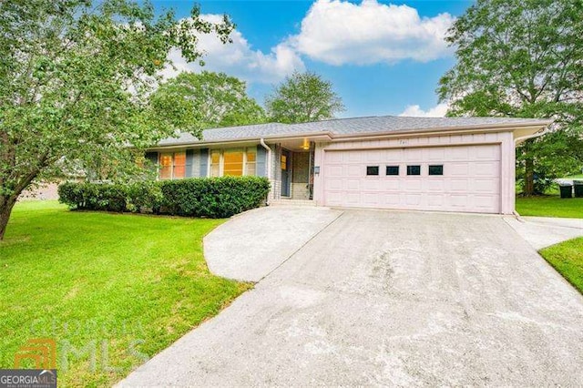741 Greenhill Dr NE, Conyers, GA 30012 - ranch-style house with a garage, driveway, and a front lawn
