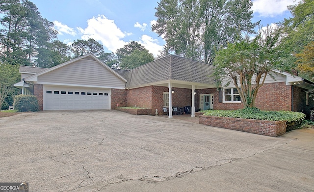 115 Shoal Creek Dr, Sharpsburg, GA 30277 - front of property featuring brick siding and driveway