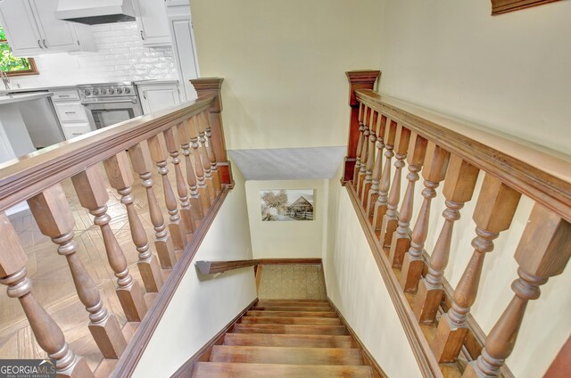 115 Shoal Creek Dr, Sharpsburg, GA 30277 - staircase with wood finished floors