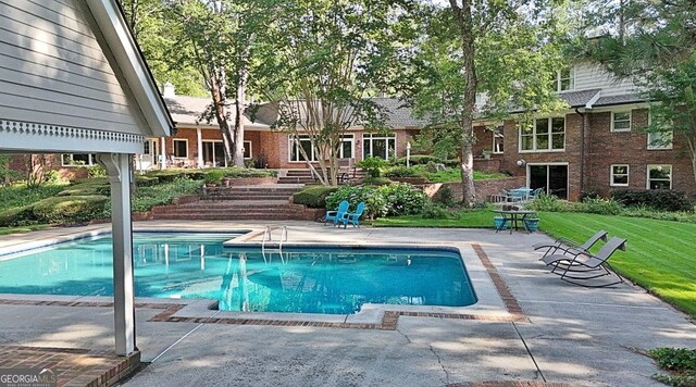 115 Shoal Creek Dr, Sharpsburg, GA 30277 - swimming pool featuring a patio area