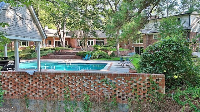 115 Shoal Creek Dr, Sharpsburg, GA 30277 - swimming pool with a patio area