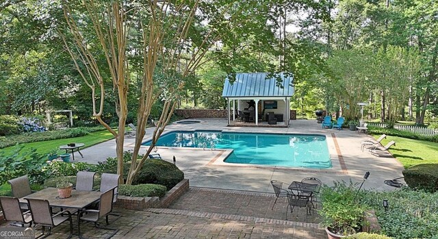 115 Shoal Creek Dr, Sharpsburg, GA 30277 - view of pool featuring an exterior structure, an outbuilding, a patio, and view of wooded area