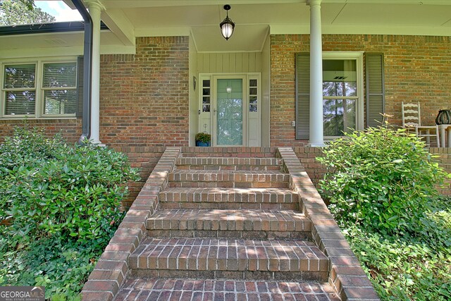 115 Shoal Creek Dr, Sharpsburg, GA 30277 - property entrance with brick siding