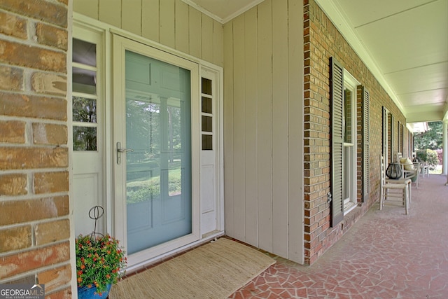 115 Shoal Creek Dr, Sharpsburg, GA 30277 - doorway to property with covered porch, brick siding, and french doors