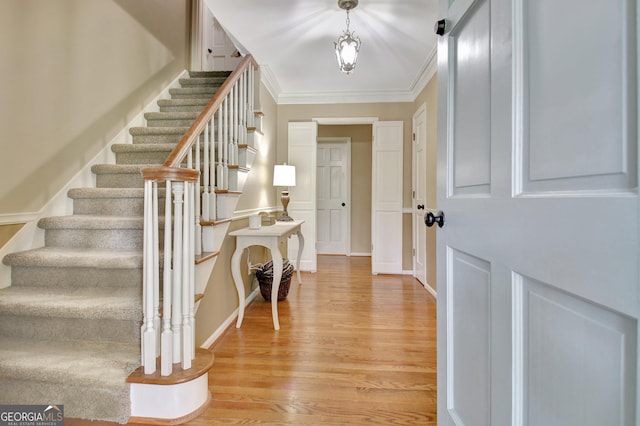 115 Shoal Creek Dr, Sharpsburg, GA 30277 - foyer with stairway, light wood-style floors, and ornamental molding