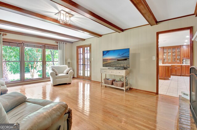 115 Shoal Creek Dr, Sharpsburg, GA 30277 - living room with beam ceiling and light wood-style flooring
