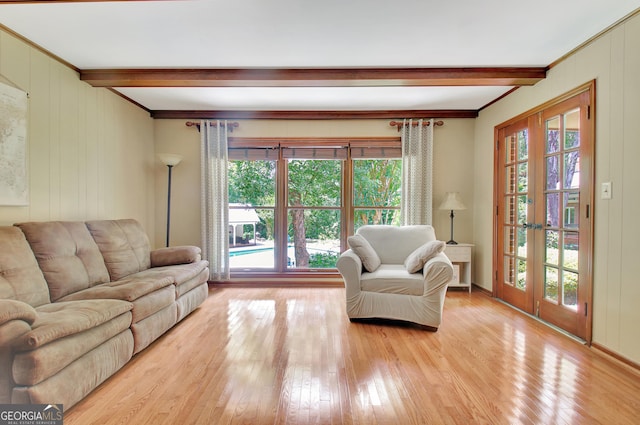 115 Shoal Creek Dr, Sharpsburg, GA 30277 - living area with beam ceiling, light wood finished floors, and ornamental molding