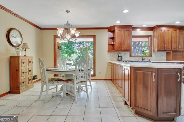 115 Shoal Creek Dr, Sharpsburg, GA 30277 - kitchen featuring a chandelier, decorative backsplash, light countertops, open shelves, and recessed lighting