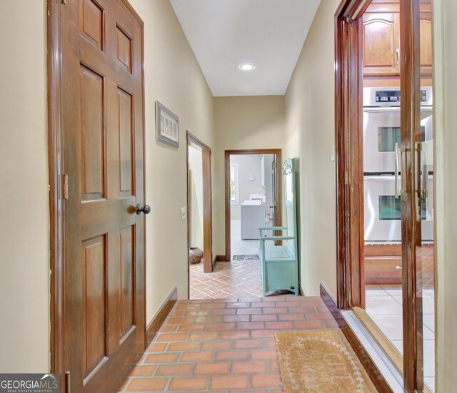 115 Shoal Creek Dr, Sharpsburg, GA 30277 - corridor featuring washer / dryer and baseboards