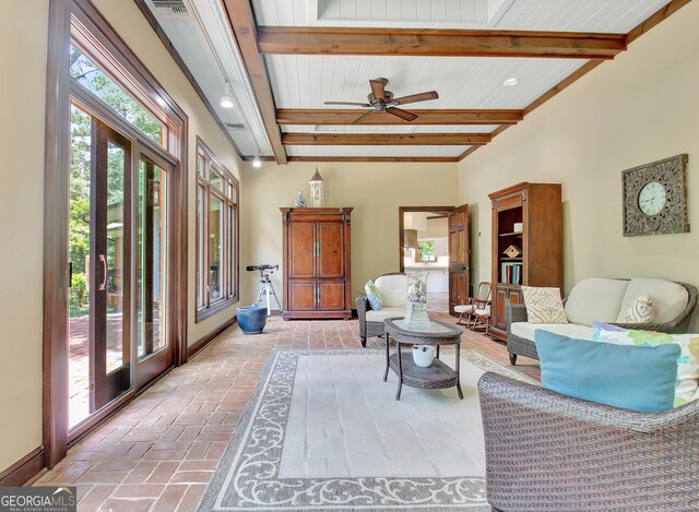 115 Shoal Creek Dr, Sharpsburg, GA 30277 - living room with beam ceiling and ceiling fan
