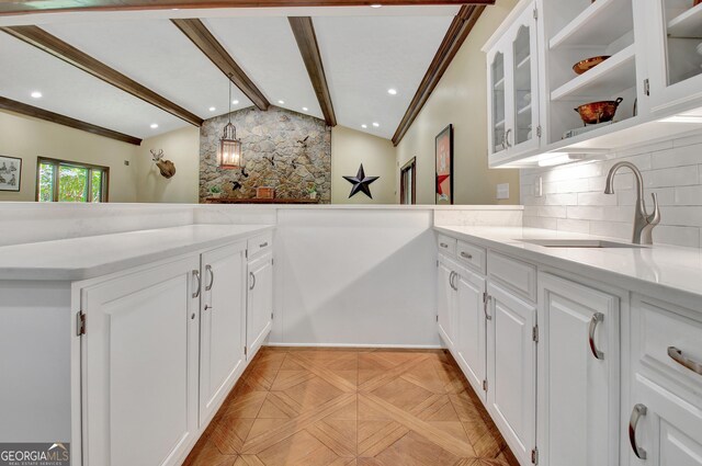 115 Shoal Creek Dr, Sharpsburg, GA 30277 - kitchen featuring backsplash, white cabinetry, glass insert cabinets, a peninsula, and recessed lighting