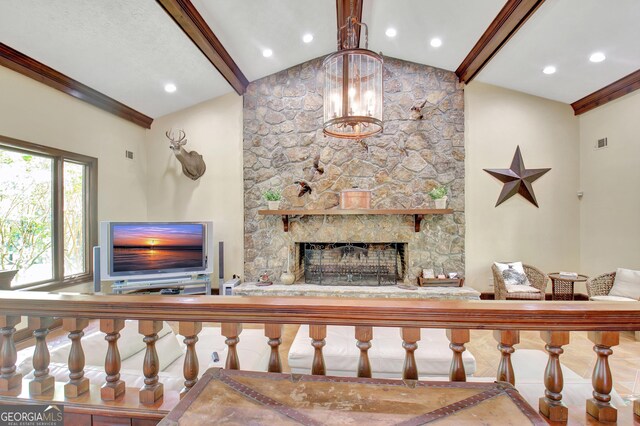 115 Shoal Creek Dr, Sharpsburg, GA 30277 - living area with a chandelier and a stone fireplace