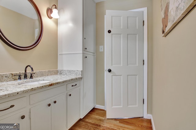 115 Shoal Creek Dr, Sharpsburg, GA 30277 - bathroom with wood finished floors and vanity