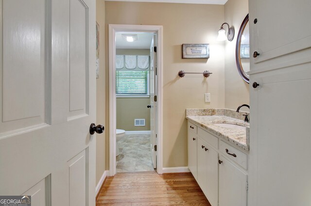 115 Shoal Creek Dr, Sharpsburg, GA 30277 - bathroom featuring vanity and hardwood / wood-style floors