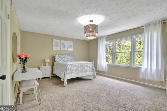 115 Shoal Creek Dr, Sharpsburg, GA 30277 - carpeted bedroom with a textured ceiling