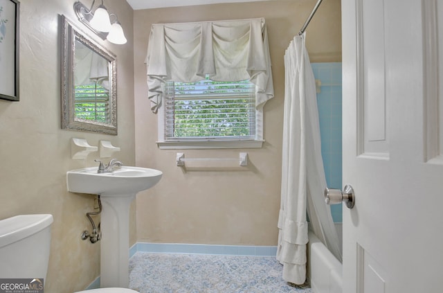 115 Shoal Creek Dr, Sharpsburg, GA 30277 - bathroom with toilet and shower / bathtub combination with curtain