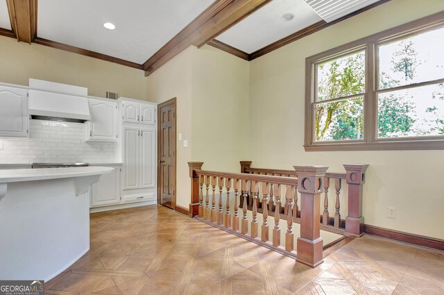 115 Shoal Creek Dr, Sharpsburg, GA 30277 - kitchen with white cabinets, crown molding, tasteful backsplash, custom exhaust hood, and recessed lighting