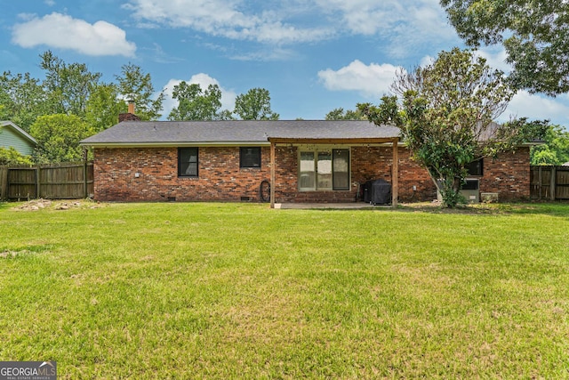 1508 Windsor Rd, Perry, GA 31069 - back of property with brick siding and a chimney