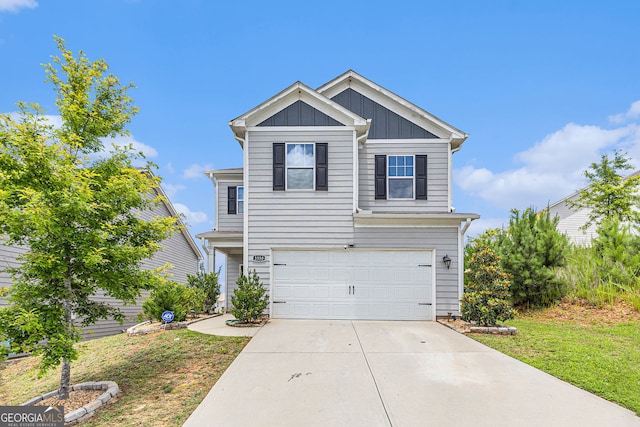 3350 Clawing Hawk Way, Douglasville, GA 30135 - traditional-style home featuring a garage, concrete driveway, and board and batten siding