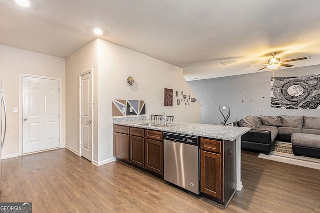3350 Clawing Hawk Way, Douglasville, GA 30135 - kitchen with dishwasher, wood finished floors, dark brown cabinetry, and ceiling fan
