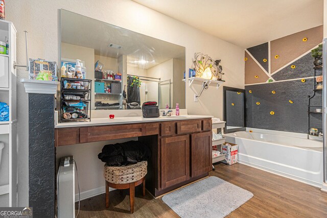 3350 Clawing Hawk Way, Douglasville, GA 30135 - full bathroom with wood finished floors, a bath, and vanity