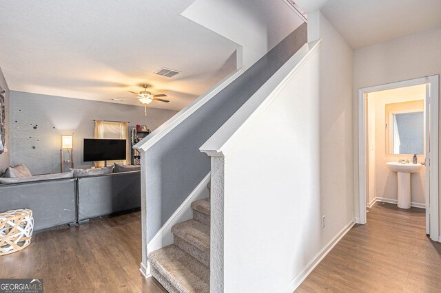 3350 Clawing Hawk Way, Douglasville, GA 30135 - stairs featuring wood finished floors and a ceiling fan