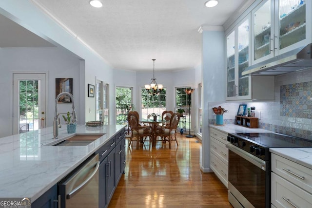 17 Shotgun Rd NW, Cartersville, GA 30121 - kitchen featuring range with electric cooktop, dishwasher, under cabinet range hood, a chandelier, and healthy amount of natural light