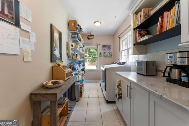 17 Shotgun Rd NW, Cartersville, GA 30121 - laundry area featuring washing machine and clothes dryer and light tile patterned floors