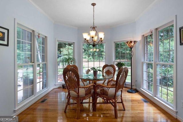 17 Shotgun Rd NW, Cartersville, GA 30121 - dining space with light wood-style floors, a chandelier, and crown molding