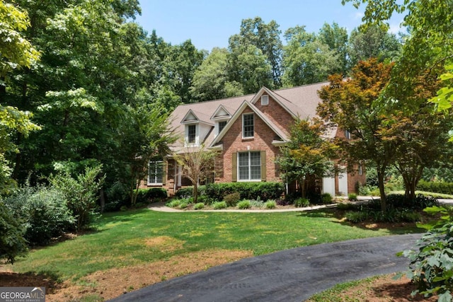 17 Shotgun Rd NW, Cartersville, GA 30121 - view of front facade featuring a front yard and brick siding