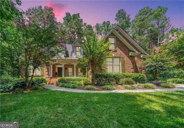 17 Shotgun Rd NW, Cartersville, GA 30121 - view of front of property with a yard, covered porch, and brick siding
