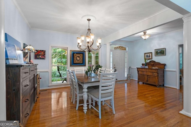 17 Shotgun Rd NW, Cartersville, GA 30121 - dining room featuring a chandelier, wood finished floors, ornate columns, and crown molding